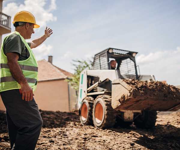 Excavation equipment and hauling truck working together on Ontario construction project